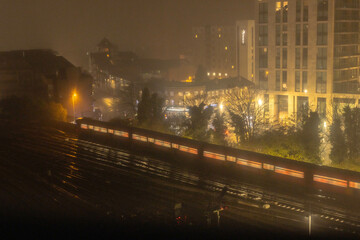 Train leaving Woking Station in the mist