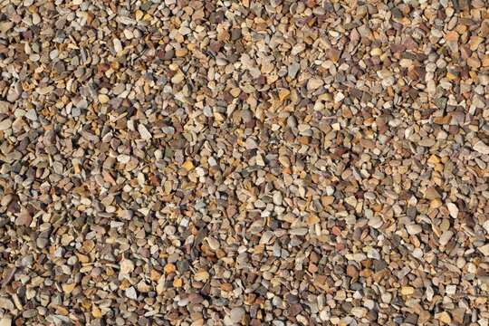 Gravel texture can vary depending on its origin and the extraction process. Generally, gravel has a rough and grainy texture, with particles that can be angular or rounded.