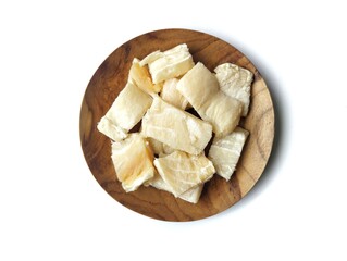 Dry salted fish on wooden plate isolated on white background with flat lay angle view setup 