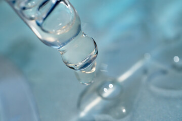 pipette with a drop of facial serum