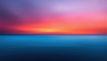 Obraz premium a blurry photo of a sunset over a body of water