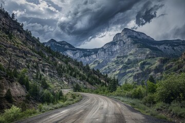 Serene Dirt Road Winding Through Rugged Mountains Under Dramatic Stormy Skies in a Remote Wilderness Area