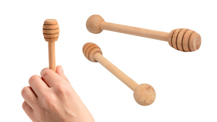 Honey dipper in woman hand isolated on a white background.