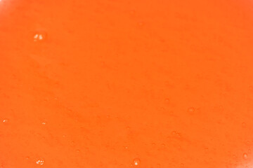 Red slime toy isolated on a white background.