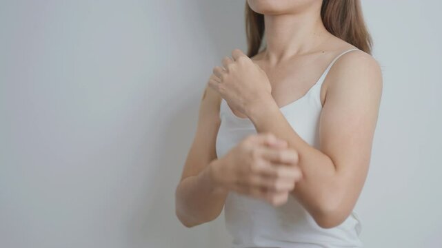 woman itching and scratching itchy arm. Sensitive Skin Allergic reaction to insect bite, food, drug dermatitis. Dermatology, Leprosy day, Systemic lupus erythematosus, Allergy symptoms and rash Eczema