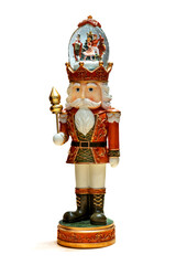 Nutcracker statue with snow globe on head for Christmas decor, isolated on white background. Place...