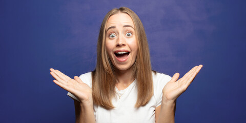 feeling happy, excited, surprised or shocked, smiling and astonished at something unbelievable