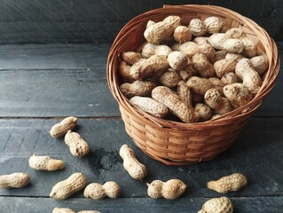 Boiled peanuts in basket on the wooden table with high angle view setup 