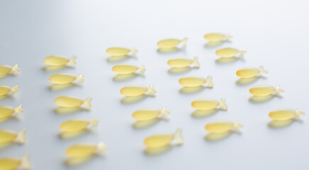 Fish-Shaped Omega-3 Capsules on White Background