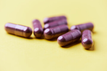 Lutein capsules. Dietary supplement on bright background. Soft focus. Close up. Copy space	