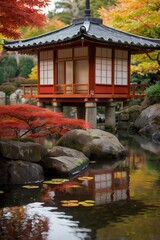 Fototapeta premium An autumn Japanese scene with vibrant red and orange maple leaves, framing a traditional teahouse near a peaceful pond. The seasonal beauty radiates warmth.