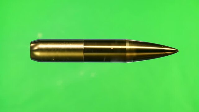 A golden metal bullet shot horizontally in a fixed position on the green screen background, generative ai