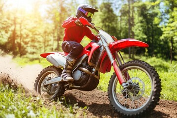 A motocross rider speeds through a dirt track on a sunny day, kicking up dust.