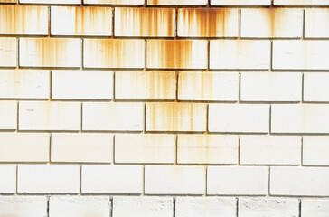 Abstract texture of a weathered cement wall with rust stains creating an interesting pattern, ideal...