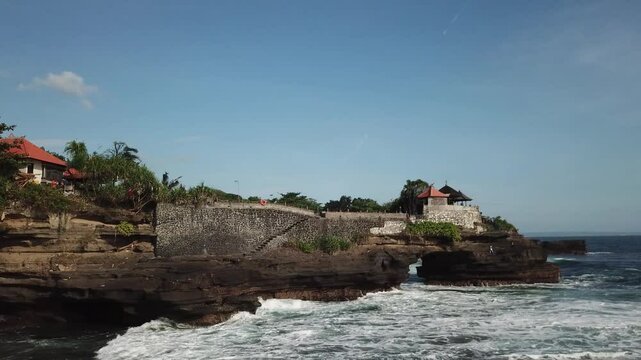 Rock formation on sea side captured by drone, waves are bashing to the rocks and gives peaceful atmosphere.