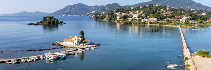 Obraz premium Vlacherna monastery and Mouse Island at Mediterranean sea panorama from above on Corfu island in Greece