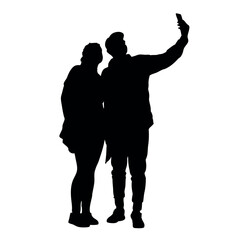 A couple standing side by side, with one person holding the phone for a selfie. The two are close together silhouette