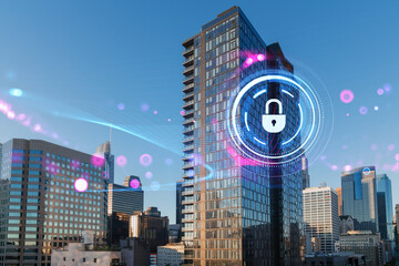 Digital lock hologram over modern city buildings showing security concept.