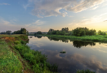 Calm river with trees in the background