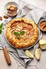 Delicious homemade apple galette with almond flakes and cinnamon