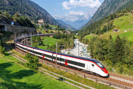 Passenger train type Stadler Giruno of Schweizerische Bundesbahnen SBB on Gotthard railway in the Swiss Alps in Wassen, Switzerland