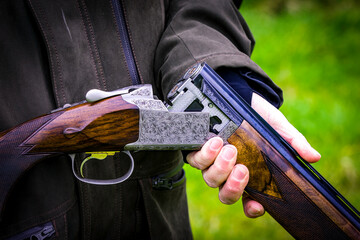 Man with broken shotgun