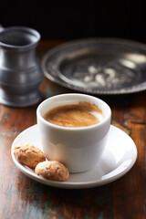 Cup of coffee on wooden background. Close up
