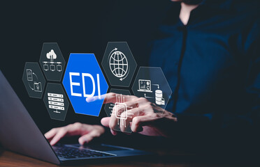 EDI, Electronic Data Interchange Concept. Businessman touching on EDI (Electronic Data Interchange) icons, global data transfer, digital security, information paperwork exchange in business context,