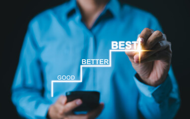 Progress from Good to Better to Best Concept. Businessman marks steps labeled 