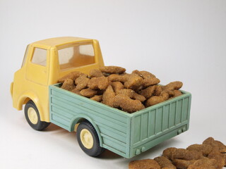 Delivery, road transport. Logistics. Animal food. Toy truck