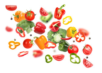 Many different fresh vegetables in air on white background