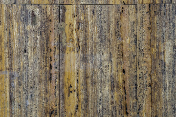 Natural rough stone surface with rich earthy tones and unique textures, ideal as an eco-friendly abstract background. Organic patterns and lines add a rustic feel to design