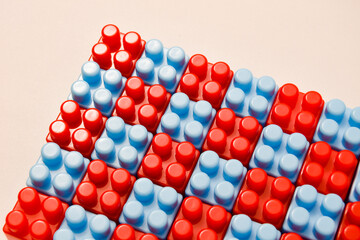 Red and blue toy blocks on a white background. Educational toys for children