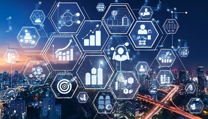 A network of interconnected hexagons containing various business and technology icons is displayed over a night view of a cityscape