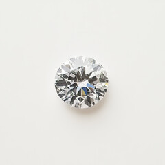 Detailed close-up of a round brilliant-cut diamond on a white background, showcasing its sparkle, clarity, and precision of facets.

