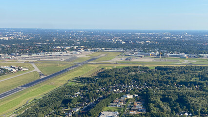 Aerial View of Airport and City Skyline on a Clear Day
