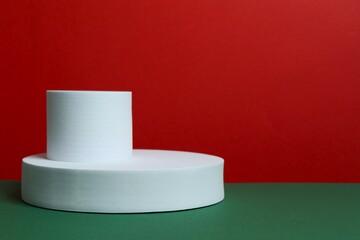 White podiums on color background 