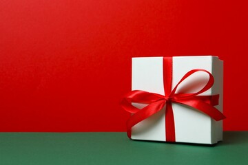 Beautiful gift boxes with ows on color background 