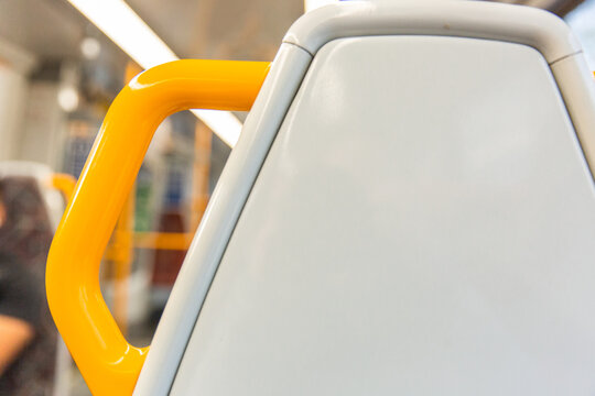 photo of the back of a train seat with built in handle