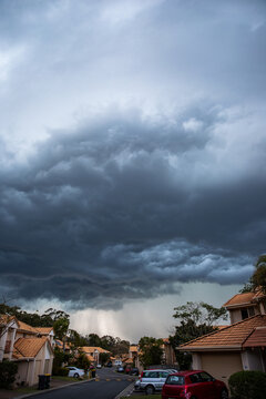 a storm rolling in over townhouses in Brisbane rain incoming