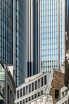 An intriguing mix of architectural styles is depicted in this city scene, showcasing a blend of old and new structures among towering skyscrapers and urban landmarks  in London UK