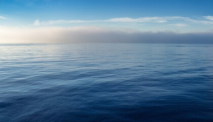 Fototapeta premium mist over a calm ocean gentle reflections and soft tones 32k full ultra hd high resolution
