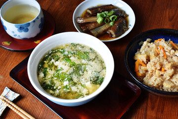 Miso soup with tofu and spinach is a savory Japanese broth made from miso paste, enriched with soft...