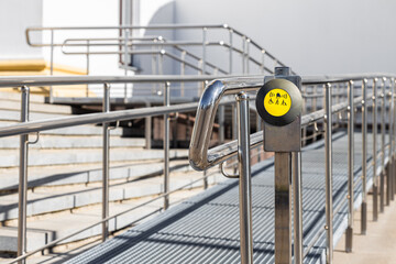 help call button on ramp for people with limited mobility. help call button. ramp for lifting