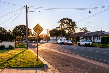 Roadside street sign with bicycle warning for cyclists in the area