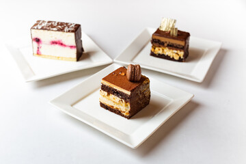Plate with slice of tasty homemade chocolate cake on white background