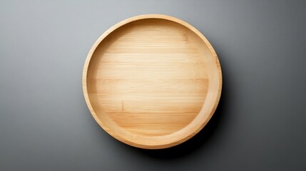 Round Bamboo Plate Isolated on Gray Background Ideal for Food Presentation and Table Decoration in Contemporary Kitchen Designs and Restaurant Styling Ideas