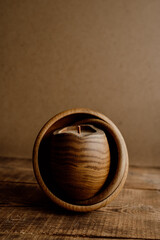 Conceptual handmade wooden candle with beeswax. A candle with a modern design