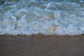 waves  crashing on the sand