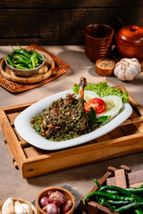 Bebek goreng cabe ijo or fried duck with green chili sauce.